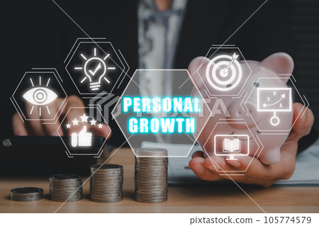 Personal growth concept, Business person hand holding piggybank and using calculator on desk with personal growth icon on virtual screen. Personal growth concept, Business person hand holding piggybank and using calculator on desk with personal growth icon on virtual screen. 105774579