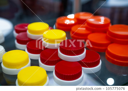 Plastic screw caps. Caps packaging concept. Bottle caps and closures packaging design. Cap products. Bottle cap. Bottle caps and closures for product branding. Innovative cap packaging concept. 105775076