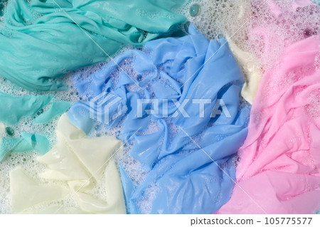 Clothes soak in powder detergent water dissolution, washing colored clothes Clothes soak in powder detergent water dissolution, washing colored clothes 105775577