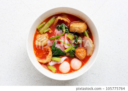 A bowl of pink flat noodles 105775764