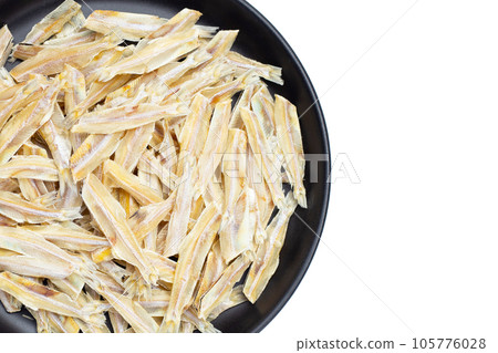 Dried anchovy on white background. Dried anchovy on white background. 105776028