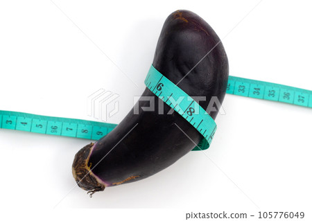 Eggplant with measuring tape on white background. Eggplant with measuring tape on white background. 105776049