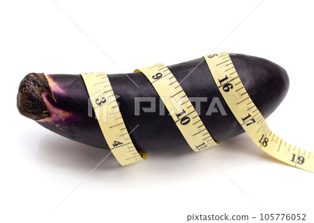Eggplant with measuring tape on white background. 105776052