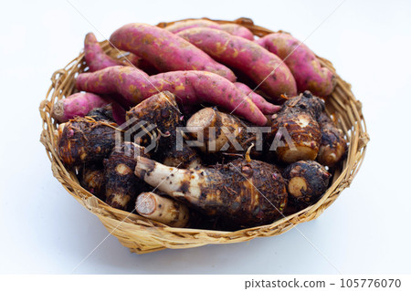 Sweet potato with taro in bamboo basket on white background. Sweet potato with taro in bamboo basket on white background. 105776070