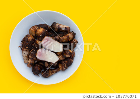 Boiled taro on yellow background. Boiled taro on yellow background. 105776071
