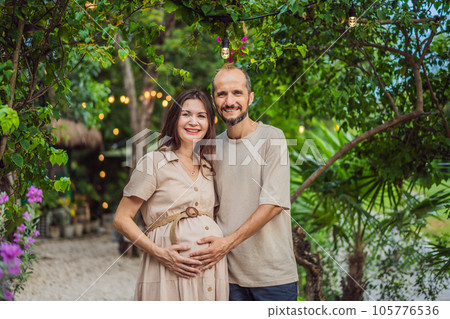 A blissful scene in the park as a radiant pregnant woman after 40 and her loving husband after 40, cherish the joy of parenthood together, surrounded by nature's serenity A blissful scene in the park as a radiant pregnant woman after 40 and her loving husband after 40, cherish the joy of parenthood together, surrounded by nature's serenity 105776536
