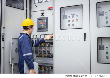 Electrical engineer working in control room. 105776652