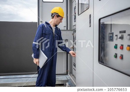 Electrical engineer working in control room. 105776653