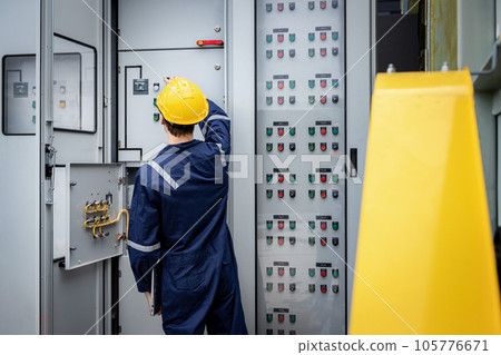 Electrical engineer working in control room. Electrical engineer working in control room. 105776671