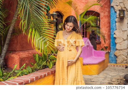 A strong and resilient woman over 40 embraces the beauty of childbirth in Mexico, celebrating the journey of motherhood with cultural richness 105776734