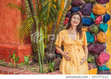 A strong and resilient woman over 40 embraces the beauty of childbirth in Mexico, celebrating the journey of motherhood with cultural richness 105777222