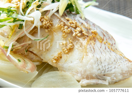 Chinese-style steamed sea bream close-up. Chinese-style steamed sea bream close-up. 105777611