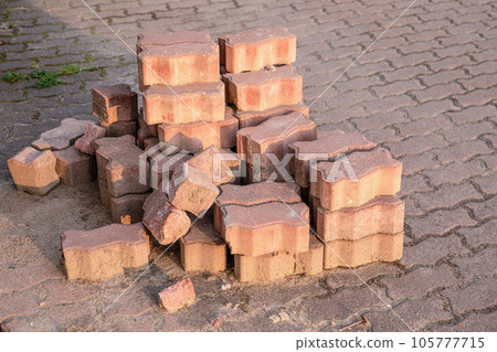 Paving slabs at construction site, material for restoration of road surface 105777715