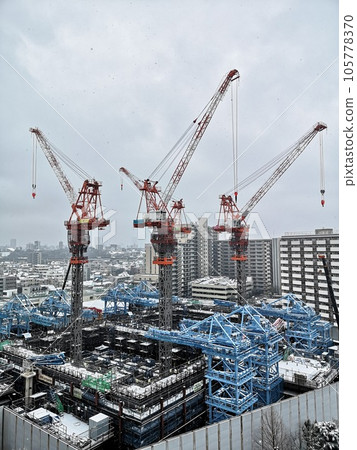 construction machinery in the snow scene 105778370