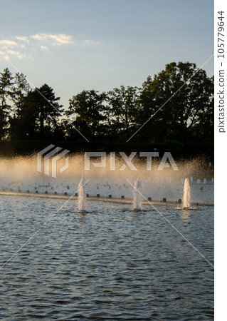 Multimedia Fountain at Centennial Hall, Wroclaw, Poland. The biggest fountain in Poland and one of the biggest in Europe. Sunlight water splashes. Beautiful architecture fountain  105779644