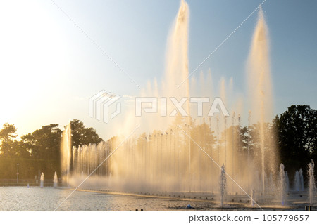 Multimedia Fountain at Centennial Hall, Wroclaw, Poland. The biggest fountain in Poland and one of the biggest in Europe. Sunlight water splashes. Beautiful architecture fountain Multimedia Fountain at Centennial Hall, Wroclaw, Poland. The biggest fountain in Poland and one of the biggest in Europe. Sunlight water splashes. Beautiful architecture fountain 105779657