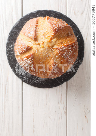 Mona or mouna of Easter is a traditional mediterranean sweet bread baked to celebrate Easter closeup. Vertical top view 105779945