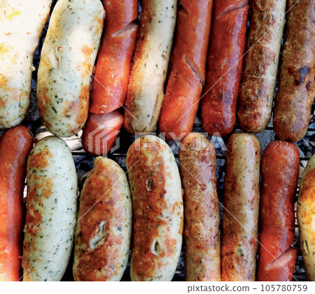 Mix of Frankfurters and Sausages Grilled on Barbecue 105780759