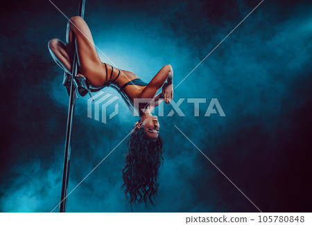 Young sexy woman pole dancing 105780848
