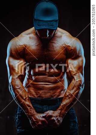 Young strong man bodybuilder 105781065