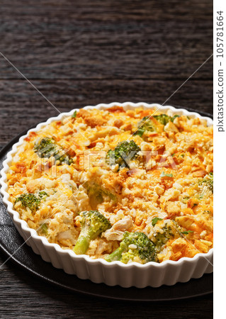 chicken rice broccoli casserole in baking dish 105781664