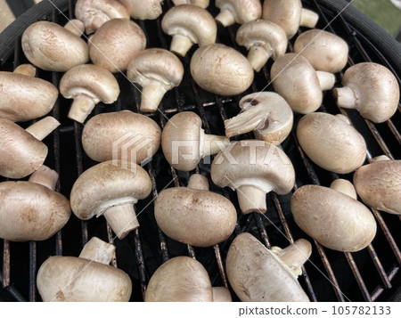 Raw champignon mushroom in bbq grill homemade juicy 105782133
