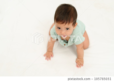 happy infant crawling on floor inside baby playpen happy infant crawling on floor inside baby playpen 105785031