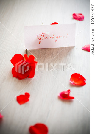 bouquet of beautiful red roses in a basket on table bouquet of beautiful red roses in a basket on table 105785477