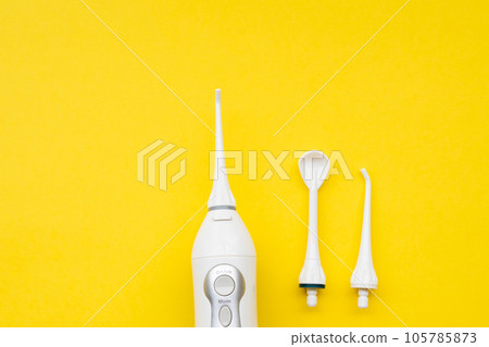 Mouth aerator on a yellow background with different nozzles. View from above Mouth aerator on a yellow background with different nozzles. View from above 105785873