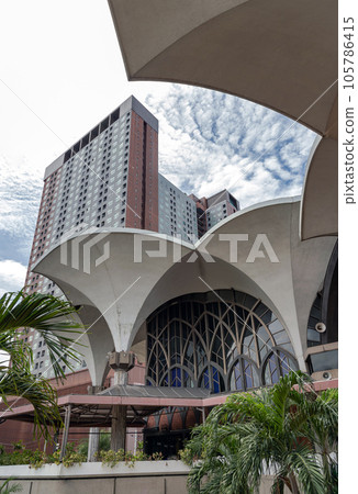 Architecture design view of the classic Central Mosque and Islamic Center with the new Condominium and sky background are coexisted perfectly. Architecture design view of the classic Central Mosque and Islamic Center with the new Condominium and sky background are coexisted perfectly. 105786415