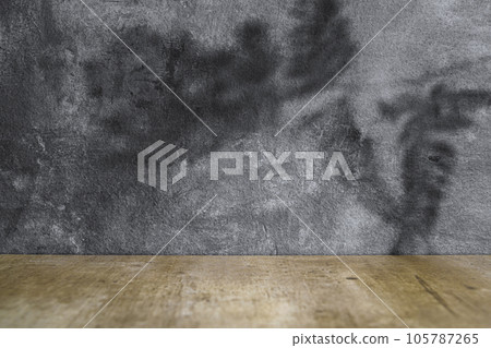 Wooden table with black wall 105787265