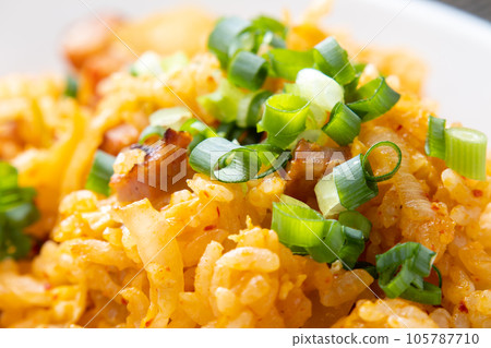 Close-up of kimchi fried rice (green onion topping). Close-up of kimchi fried rice (green onion topping). 105787710