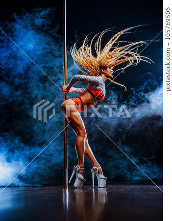 Young sexy woman pole dancing Young sexy woman pole dancing 105789506