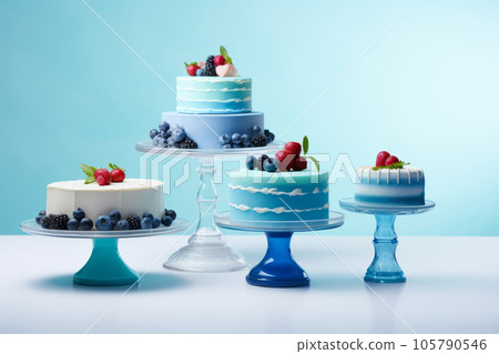 Blue cakes on a blue background. A variety of confectionery products. Blue cakes on a blue background. A variety of confectionery products. 105790546
