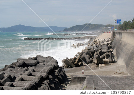 Waves hitting the coast as a typhoon approaches Waves hitting the coast as a typhoon approaches 105790857