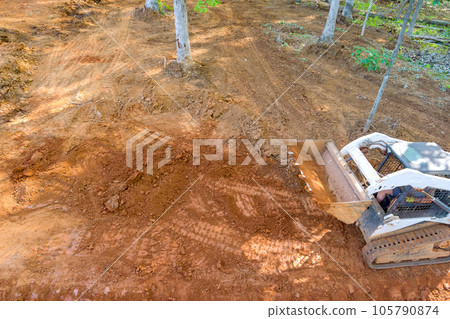 Tractor are essential machines in construction projects as they efficiently transport relocate earth during site preparation. Tractor are essential machines in construction projects as they efficiently transport relocate earth during site preparation. 105790874