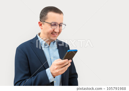 Business happy man using phone on white background. 105791988
