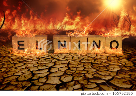 Wooden block of El Nino on the cracked mud and wild fire background. climate change and global warming concept 105792190