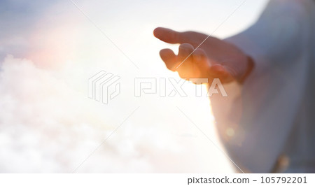 Jesus Christ with open arms reaching out in the sky, hand gestures of Jesus dying on the cross and resurrected, heaven and salvation, faith and love, easter concept 105792201