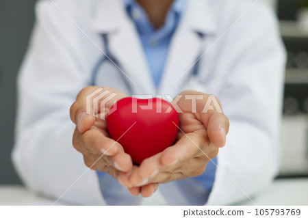 Doctor man holding red heart, Cardiology concept. Doctor man holding red heart, Cardiology concept. 105793769