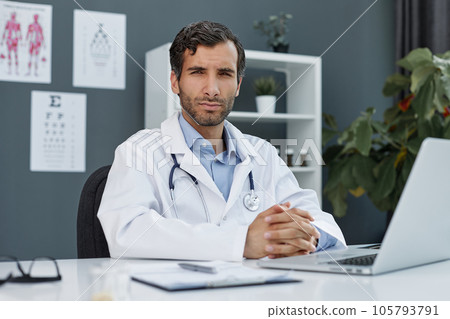 Portrait of happy arabic doctor posing at clinic Portrait of happy arabic doctor posing at clinic 105793791