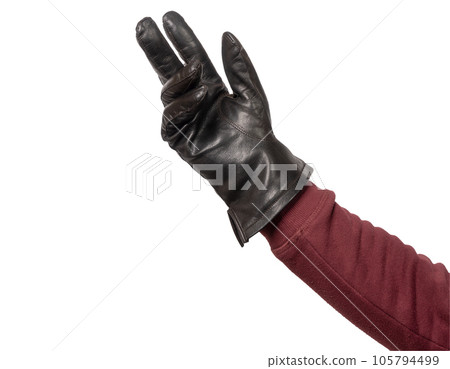 a hand with black leather glove worn a hand with black leather glove worn 105794499
