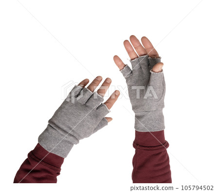 two hands in gray gloves without fingers two hands in gray gloves without fingers 105794502