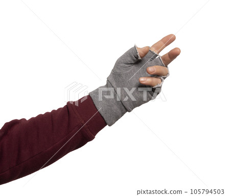 a hand with the gray fingerless glove a hand with the gray fingerless glove 105794503