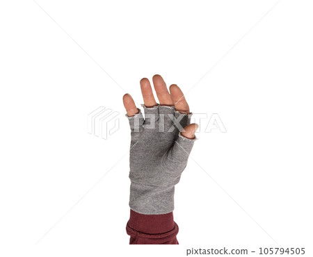 a hand with the gray fingerless glove 105794505