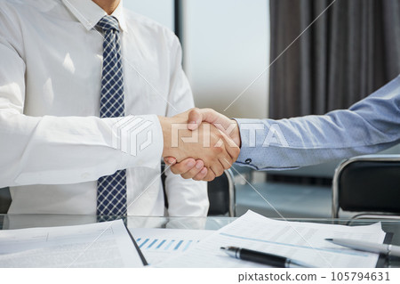 Business meeting. Close-up of young people communicating with each other in office 105794631