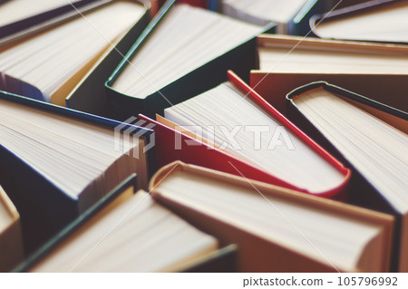 Many hardbound books background, selective focus Many hardbound books background, selective focus 105796992