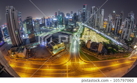 Panorama of Bay Avenue with modern towers residential development in Business Bay aerial all night timelapse, Dubai Panorama of Bay Avenue with modern towers residential development in Business Bay aerial all night timelapse, Dubai 105797060