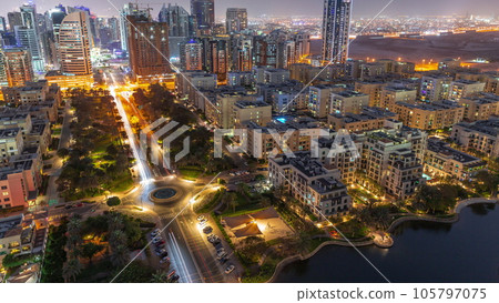 Skyscrapers in Barsha Heights district and low rise buildings in Greens district aerial day to night timelapse. Skyscrapers in Barsha Heights district and low rise buildings in Greens district aerial day to night timelapse. 105797075