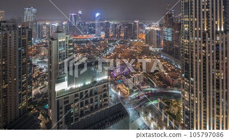 Panorama showing aerial view of a big futuristic city night timelapse. Business bay and Downtown 105797086